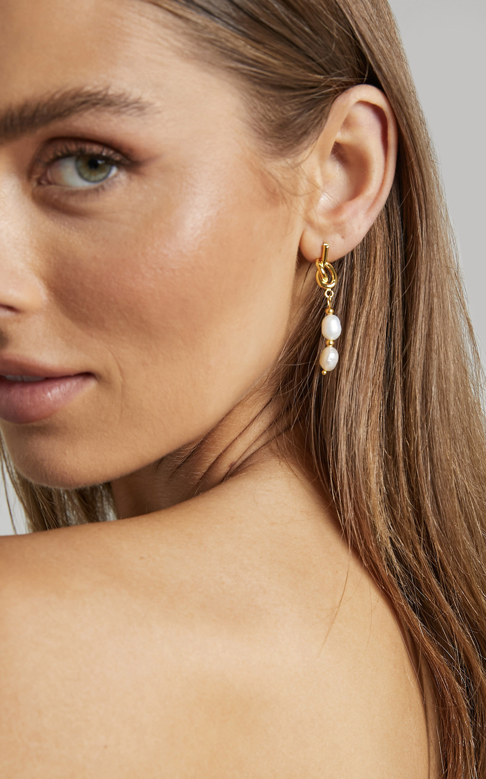 Krishna Earrings in Gold | Showpo