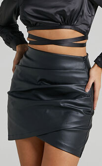 Ashlyn Faux Leather Overlap Mini Skirt in Black
