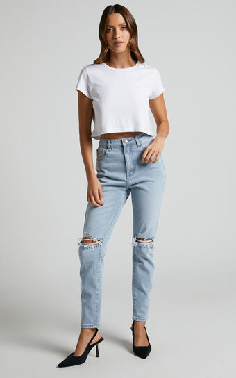 Izira High Waisted Ripped Mom Jeans in Mid Blue Wash