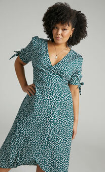 Dont Dream Its Over Wrap Midi Dress in Emerald Floral
