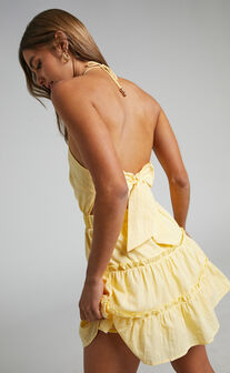 Maryani Backless Tiered Halter Mini Dress in Pastel Yellow